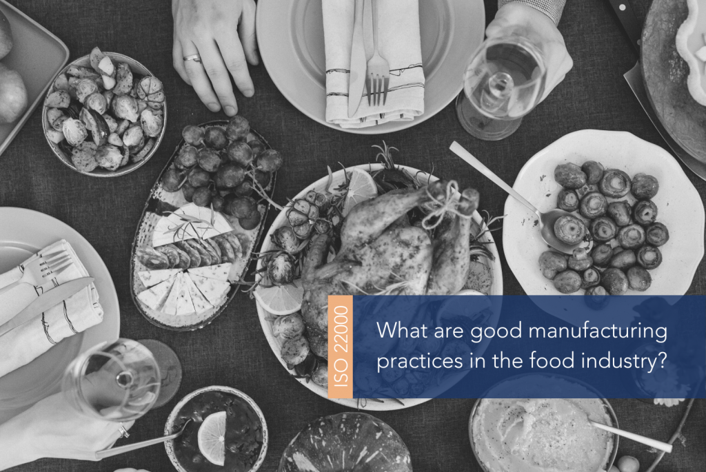 Food on a table surrounded by hands