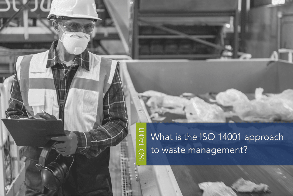 What is the ISO 14001 approach to waste management MAIN A person wearing a hard hat and holding an object