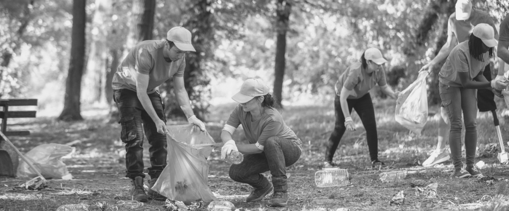 A group of people picking up trash