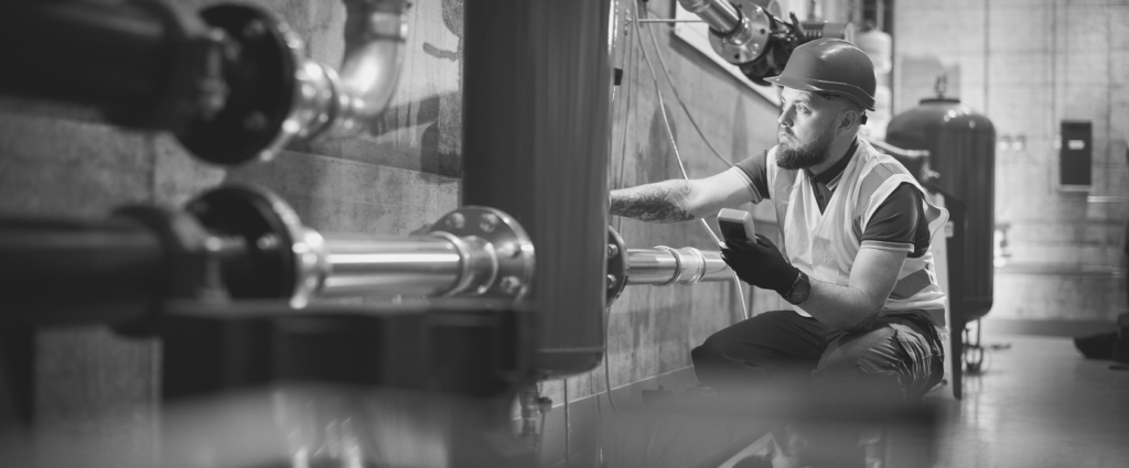 ISO 9001 Header B&W A person working in a factory