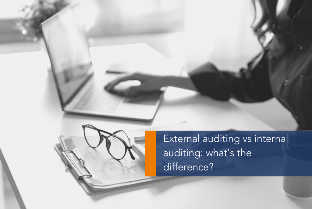 External vs Internal Auditing MAIN A person typing on a computer
