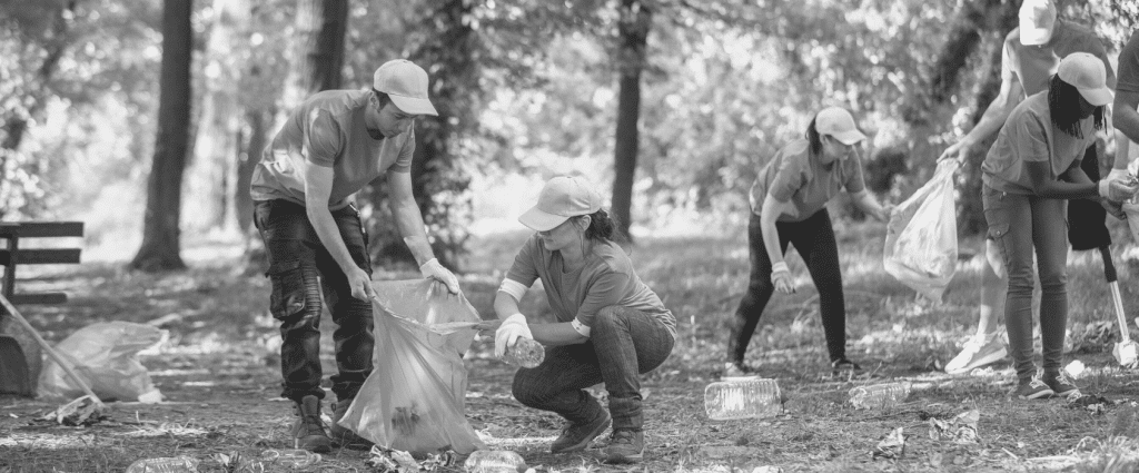 A group of people picking up trash