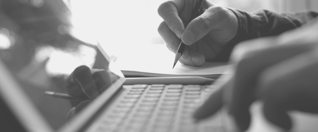 Close-up of a hand writing on a piece of paper