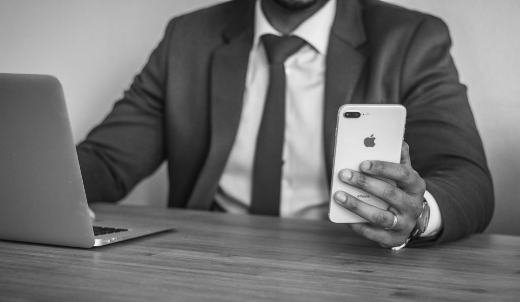 Office man checking his phone