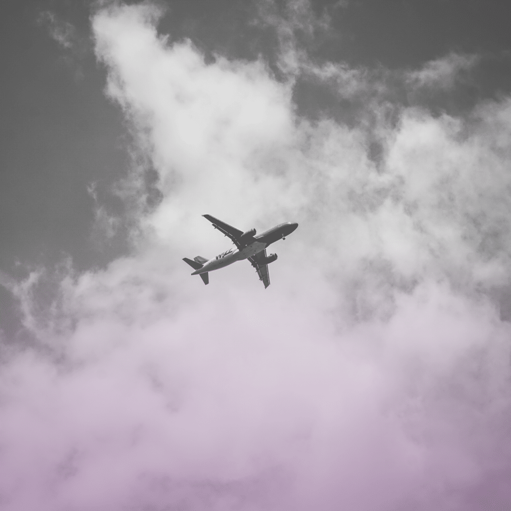 Airplane in the sky surrounded by clouds