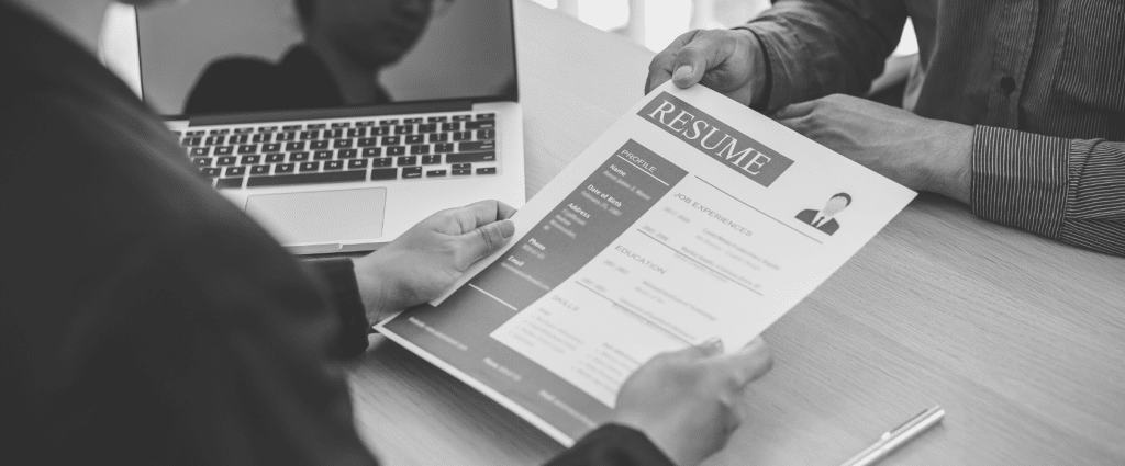 Close-up of hands holding a resume