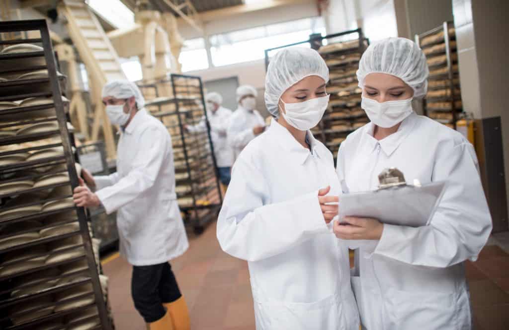 Women working at a food factory ISO 22000